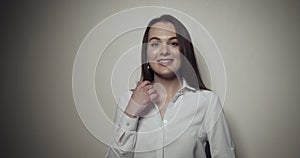 Young business woman over grey background