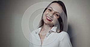 Young business woman over grey background