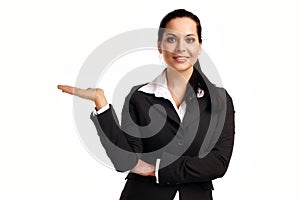 Young business woman pointing at copyspace