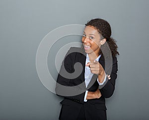 Young business woman pointing finger at you