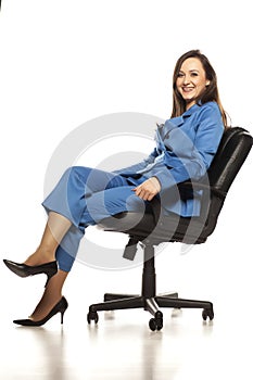 Young business woman seating on the chair