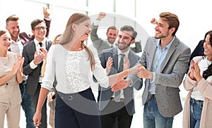 young business woman shaking hands with her colleague