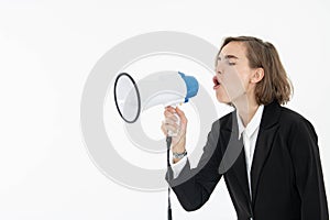 Young business woman is shouting through a megaphone