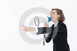 Young business woman is shouting through a megaphone