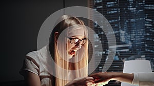 Young business woman showing her excitement after looking at friend`s engagement ring