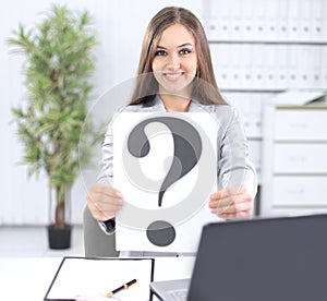 Young business woman showing a question mark,