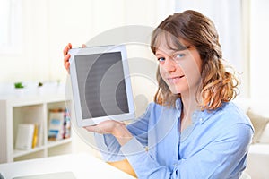 Young business woman showing a tablet screen