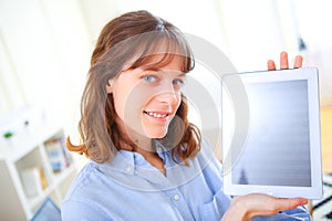 Young business woman showing a tablet screen