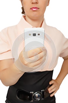 Young business woman showing white mobile phone