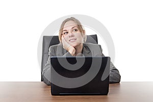 Young business woman sitting a her desk