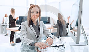 young business woman sitting at office Desk.