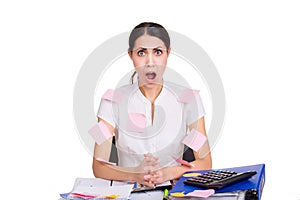 Young business woman sitting stressed in office