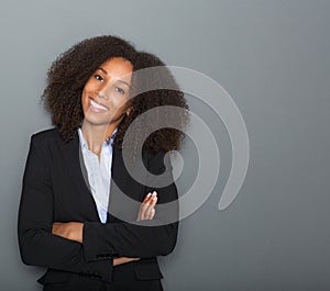 Young business woman smiling with arms crossed