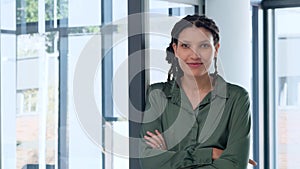 Young business woman smiling, happy about her new office. Stylish African American female accounting clerk looking