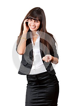 Young business woman speaking by mobile phone