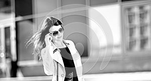 Young business woman standing on the street near the office building