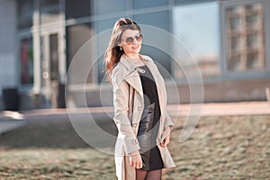 Young business woman standing on the street near the office building