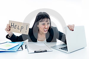 Young business woman stressed and desperate with laptop. frustrated