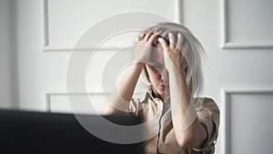 Young business woman stretching her arms and smiling in good mood at work time. Fashionable adult Female hard working