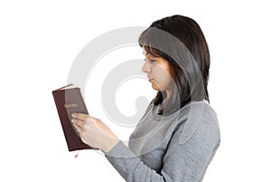 Young business woman studying a bible