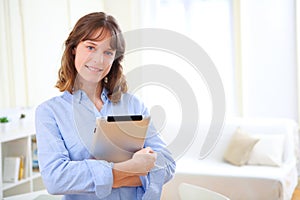 Young business woman with a tablet