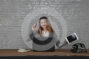 Young business woman talking on the phone, holding calculator in her hand