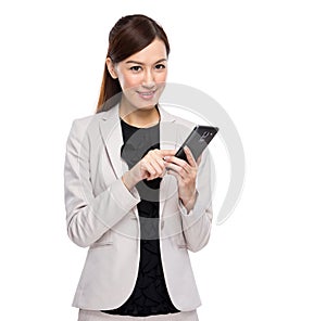 Young business woman texting with mobile phone