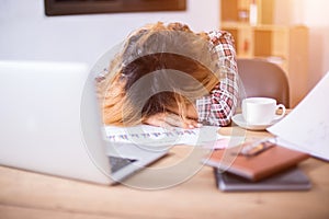 Young business woman tired and headache about her work