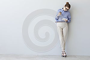 Young business woman using digital tablet