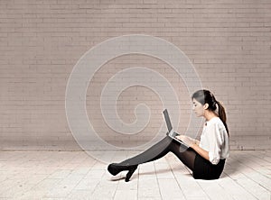 Young business woman using a laptop