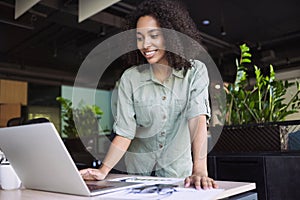 Young business woman using laptop computer at office, Student girl working at modern workspace