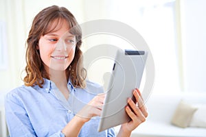 Young business woman using a tablet