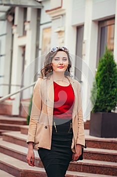 Young business woman walking down the street