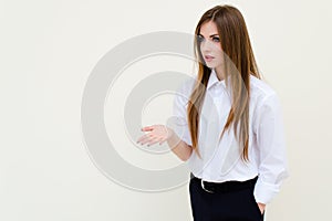 Young business woman wearing man's shirt presenting copyspace