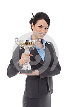 Young business woman winning a trophy