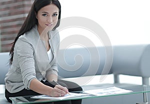 Business woman working with documents in the office