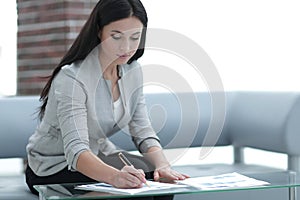 Business woman working with documents in the office