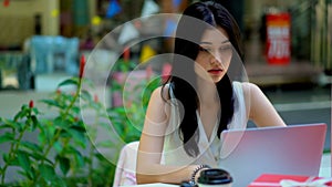 Young business woman working with laptop at outdoor