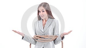 Young business woman wrapped a rope.