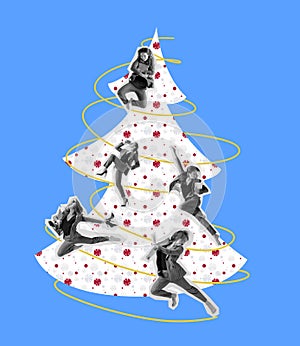 Young business women decorating a creative christmas tree isolated on blue background. Holiday, winter, wishes, New Year