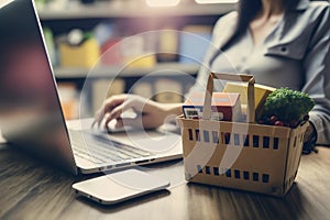 Young business women typing in front of laptop shopping online..