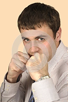 Young businessman in agressive pose