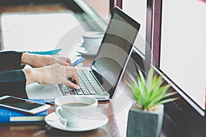 Young Businessman Analyzing Graph On Computer At Workplace