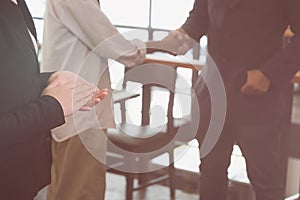 young businessman applauding to speaker after seminar presentation. business partners clapping hands after work meeting.