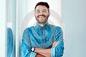 Young businessman, arms crossed and happy in portrait for new job, internship or promotion in workplace. Male person