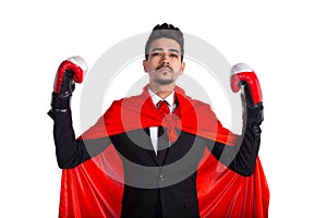 Young businessman in boxing gloves and superhero red cape