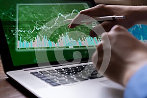 young businessman broker watching on the stocks on his devices