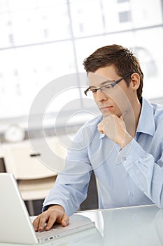 Young businessman concentrating on computer work