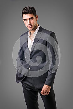 Young businessman confidently posing isolated on white photo