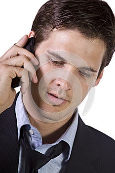 Young businessman conversing on cell phone photo